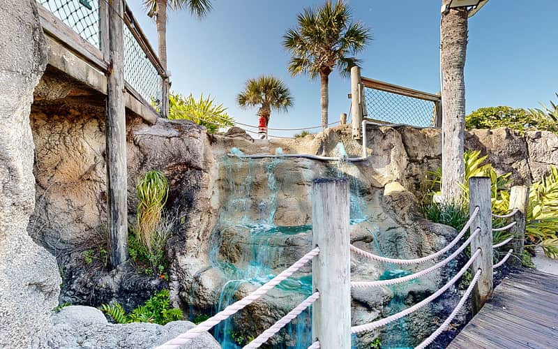 The grotto waterfall and pool beside the green